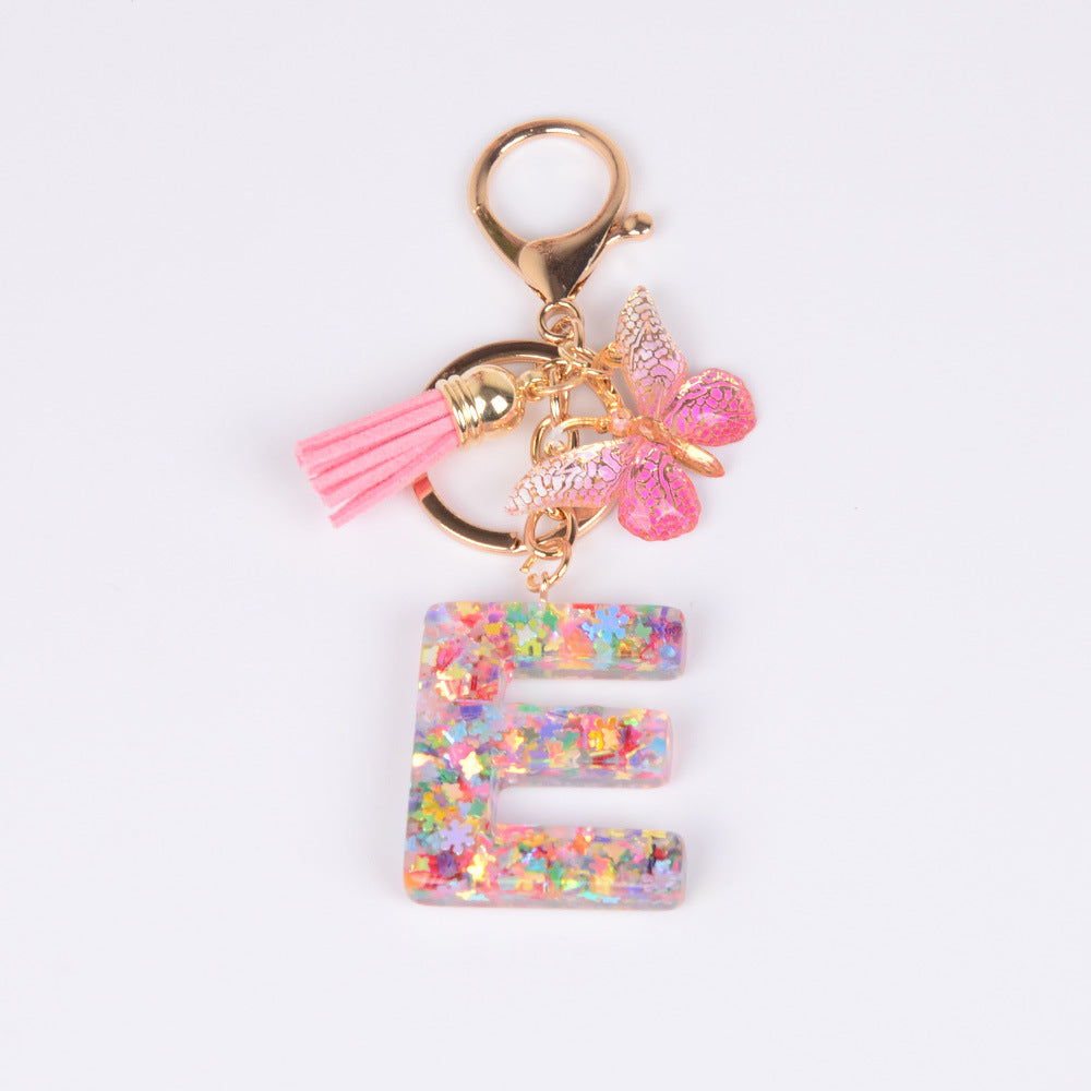 卸売スパンコール英語蝶タッセル文字樹脂キーホルダー