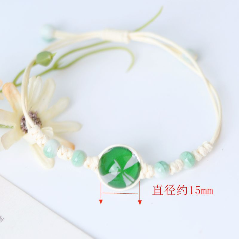 Pulsera tejida a mano de flores secas de cuatro hojas de cuatro hojas