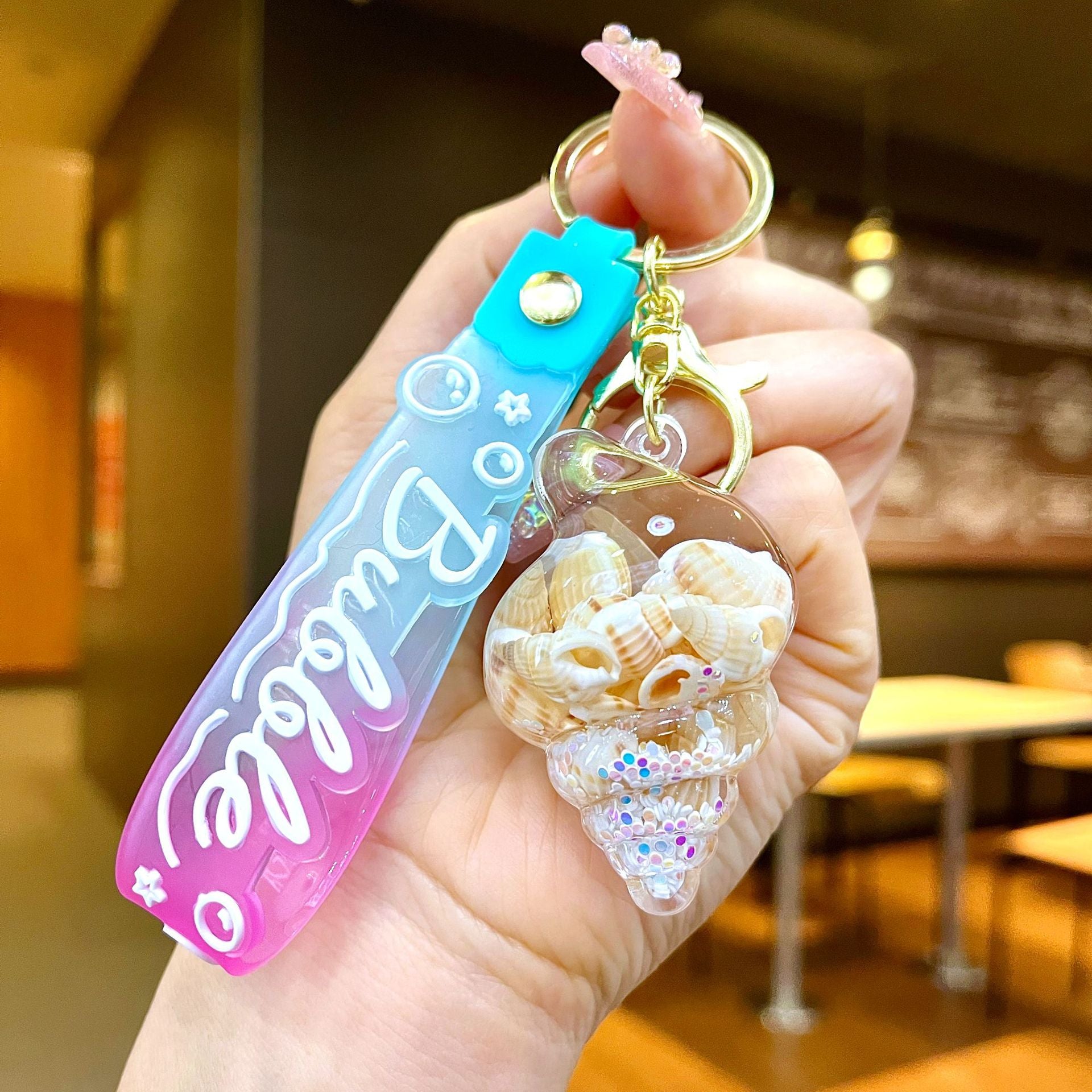 Wholesale Colorful flowing sand seashell DIY insert oil keychain