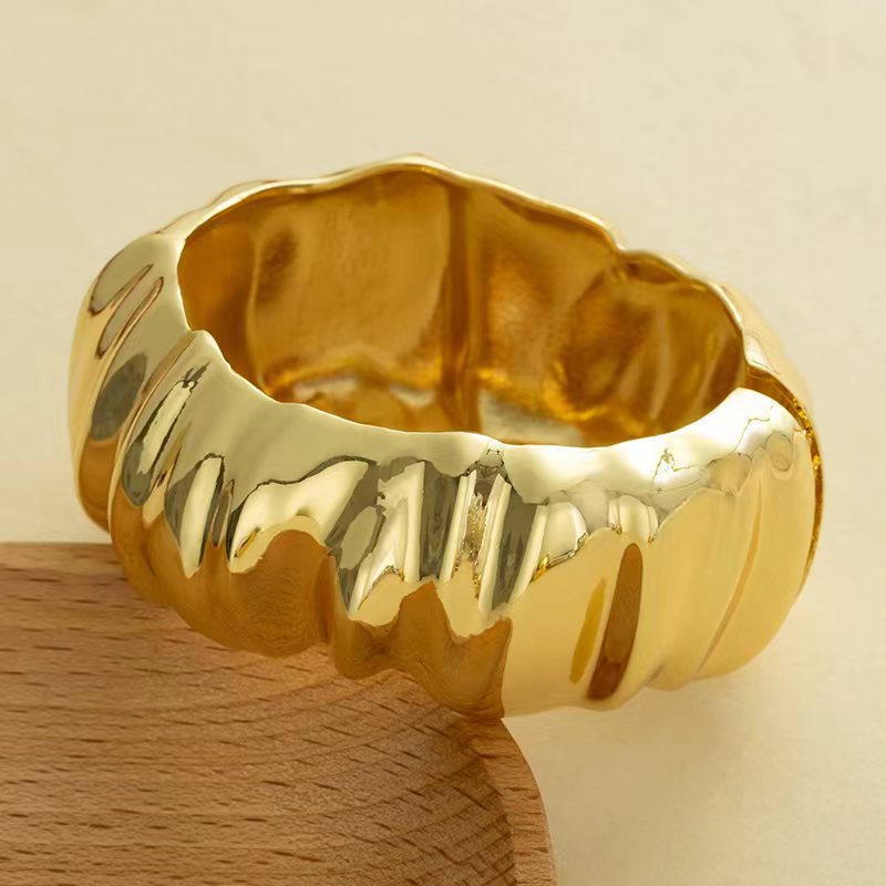 Wholesale Golden wide edged wave band exaggerated bracelet