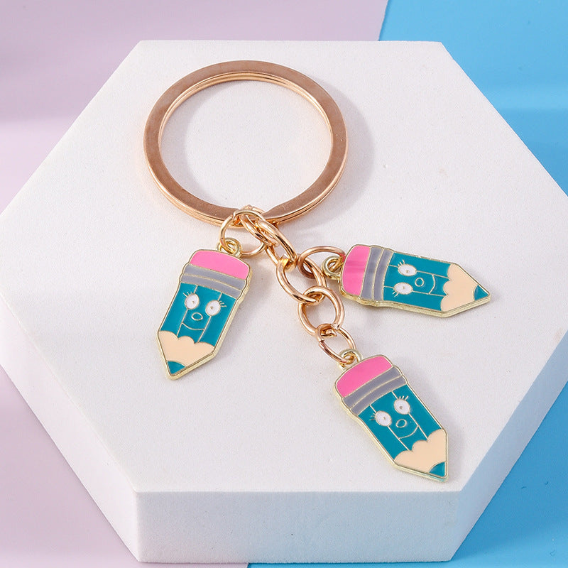 Wholesale Cartoon Crayon Pencil Zinc Alloy Keychain
