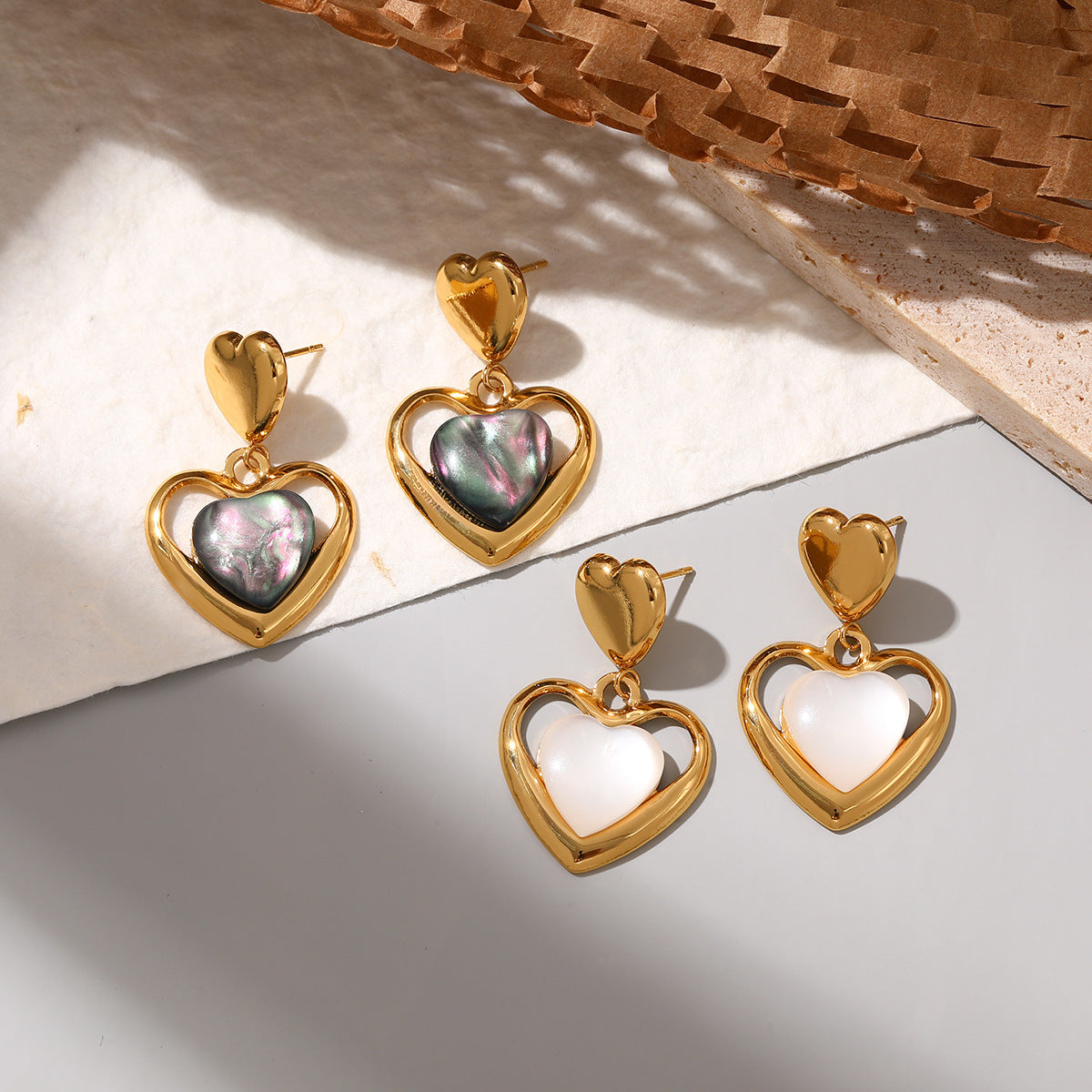 Wholesale Stainless steel heart earrings for women inlaid with cat' s eye stone