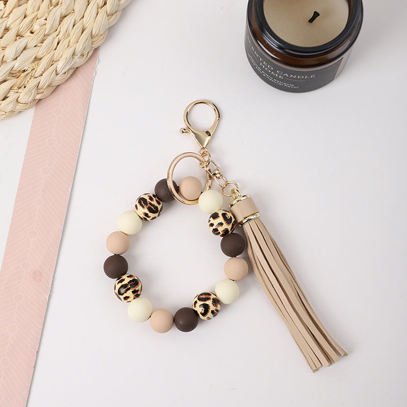 Llavero de muñeca de silicona de borla al por mayor