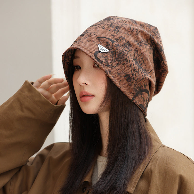 Wholesale New autumn and winter printed pile hats,  windproof and face-revealing small bun hats,  warm cold hats