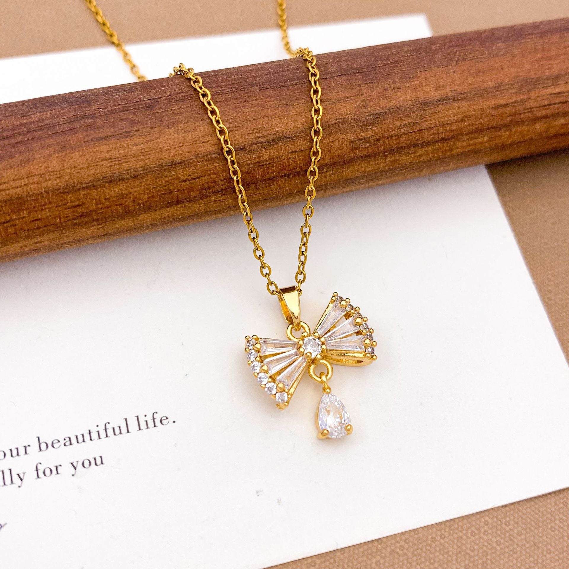 Wholesale Pink heart-shaped bow with diamond studded titanium steel necklace