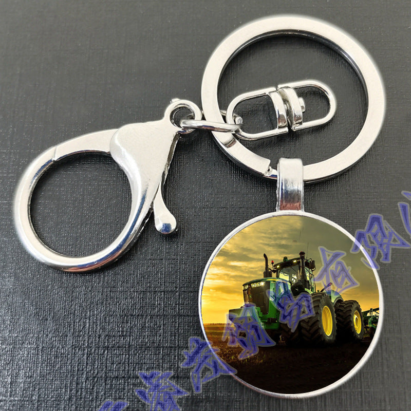 卸売タイムジェムトラクターラウンドガラスメタルキーホルダー