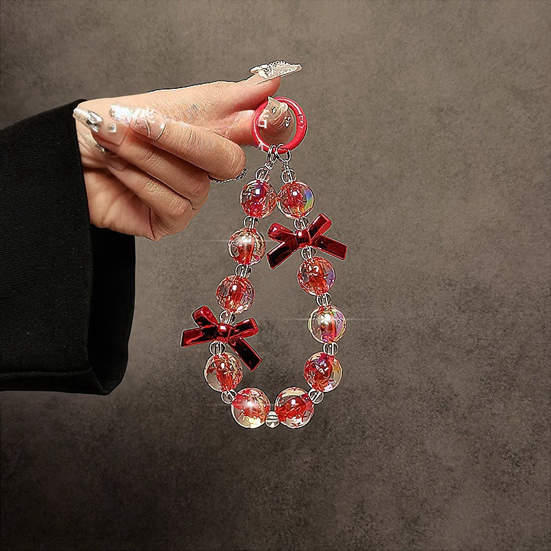 Wholesale Handmade beaded personality fashion bow short wrist hand chain mobile phone lanyard mobile phone case pendant