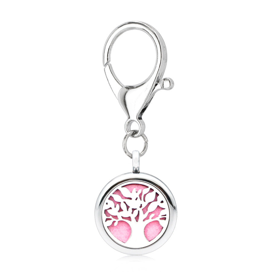 Aleación al por mayor de 25 mm hueco nuevo alas de flores aromaterapia llavero esencial de aceite