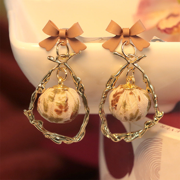 Wholesale Bow Hollow Alloy Earrings
