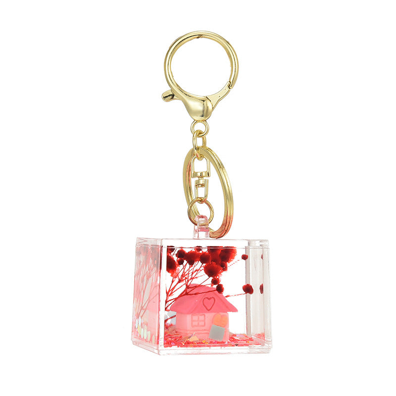 Wholesale Acrylic flowing sand in oil bottle keychain