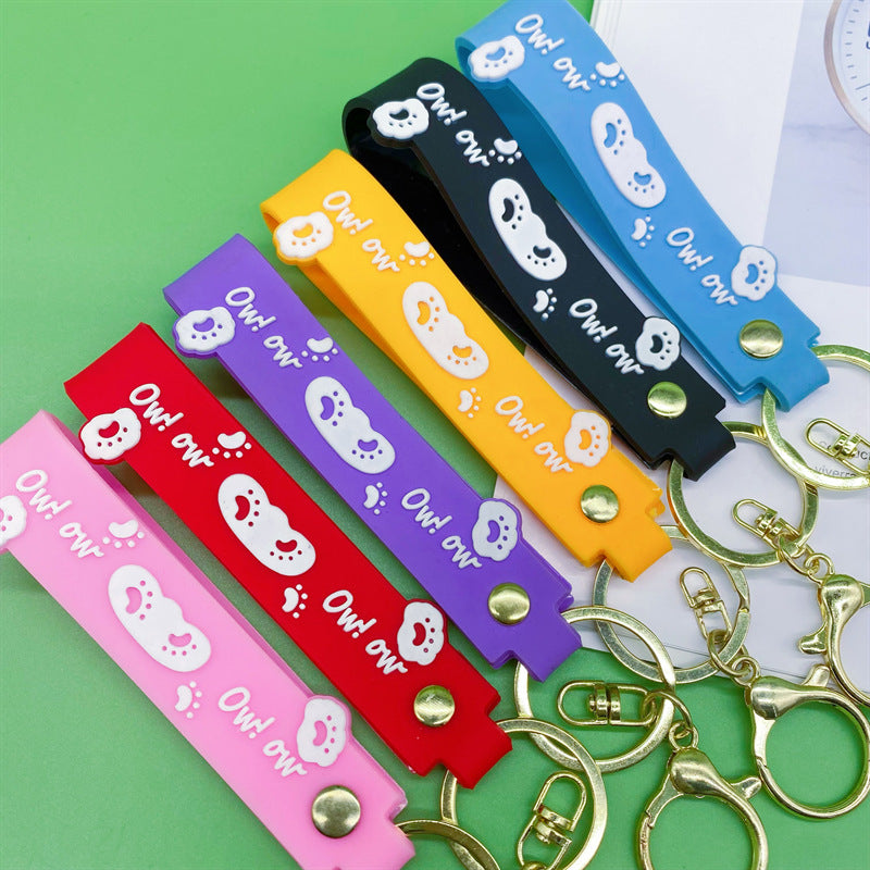Al por mayor 10pcs PVC Dog Claw Cat Claw Keychain Rope de cuero