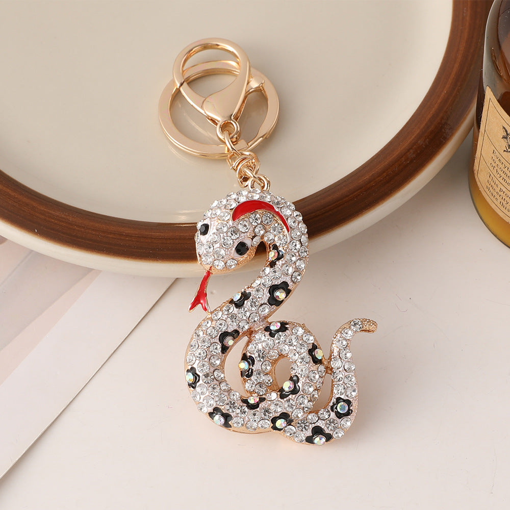 Wholesale Creative cartoon diamond twelve zodiac snake metal car keychain national tide this year pendant small gifts