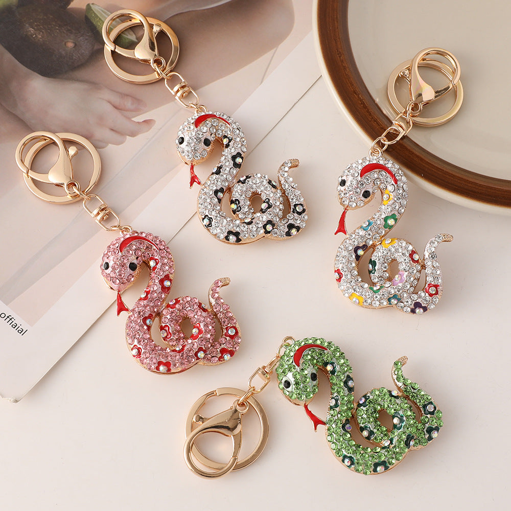 Wholesale Creative cartoon diamond twelve zodiac snake metal car keychain national tide this year pendant small gifts