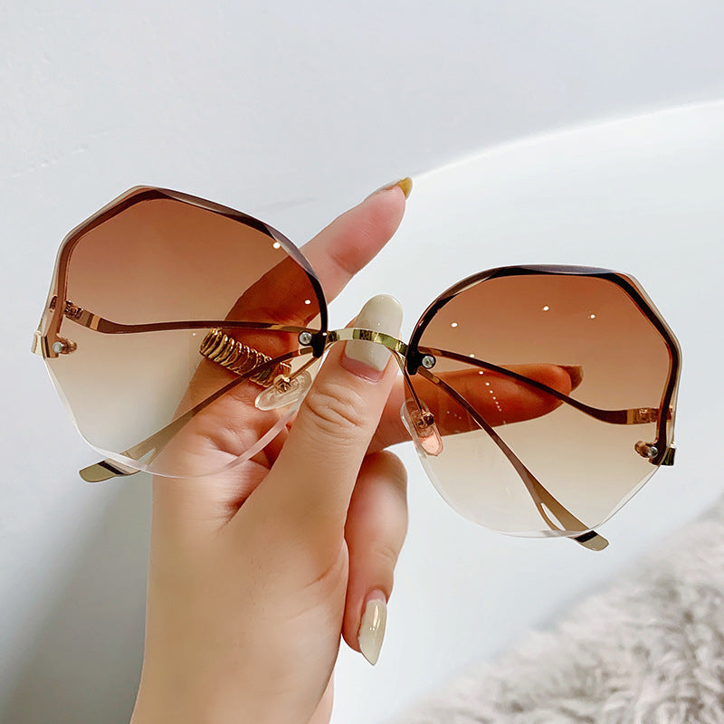 Wholesale Large framed rimless trimmed women's sunglasses