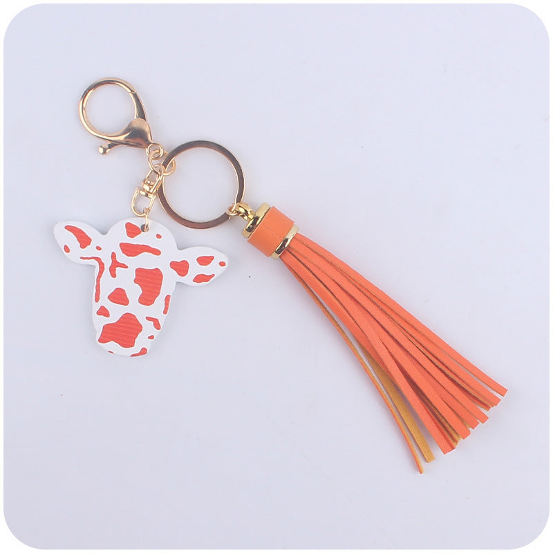Caricatura al por mayor de toro occidental cabeza de madera colorida llavero largo de borla larga