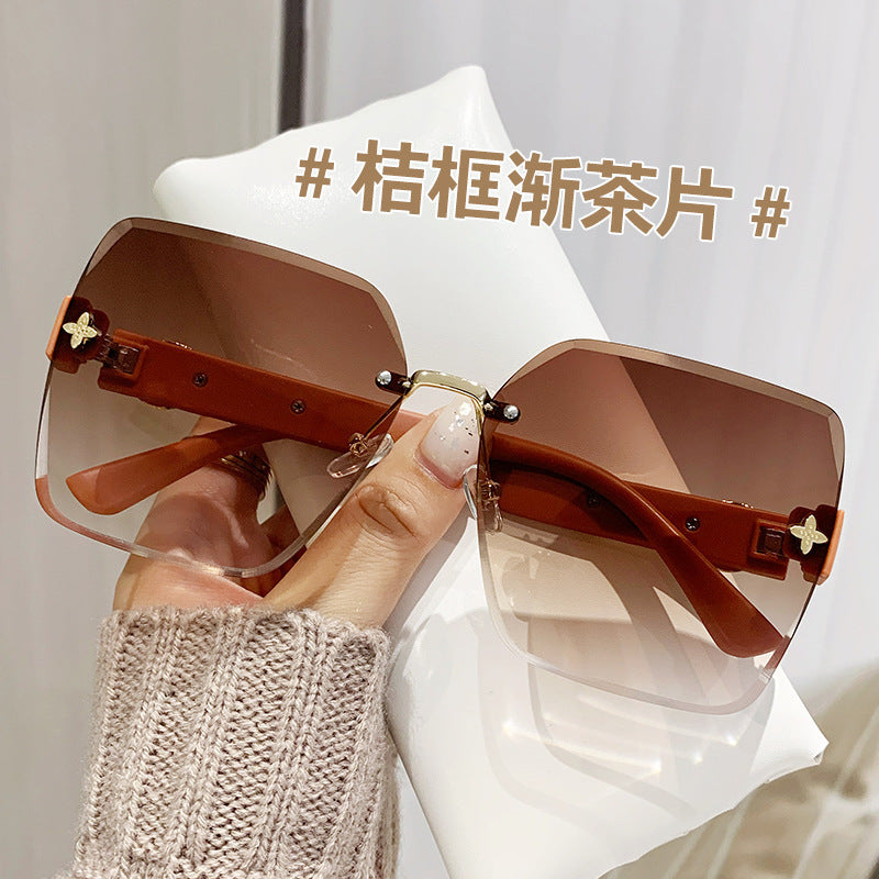Wholesale Frameless Trimmed Trendy Sunglasses