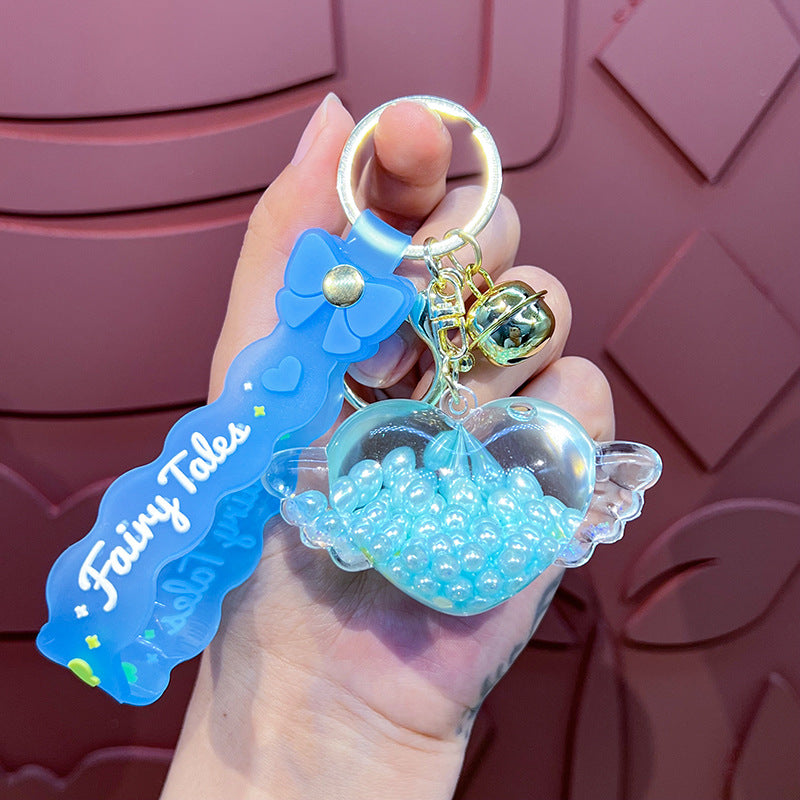 Wholesale Oil-infused Golden Bean Wing Heart Keychain