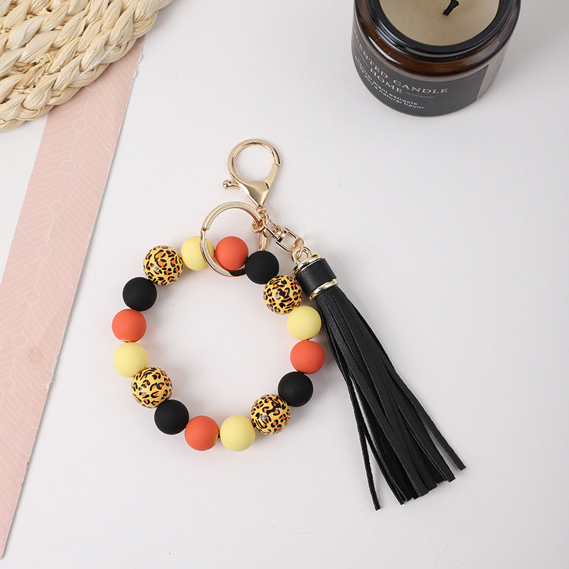 Llavero de muñeca de silicona de borla al por mayor