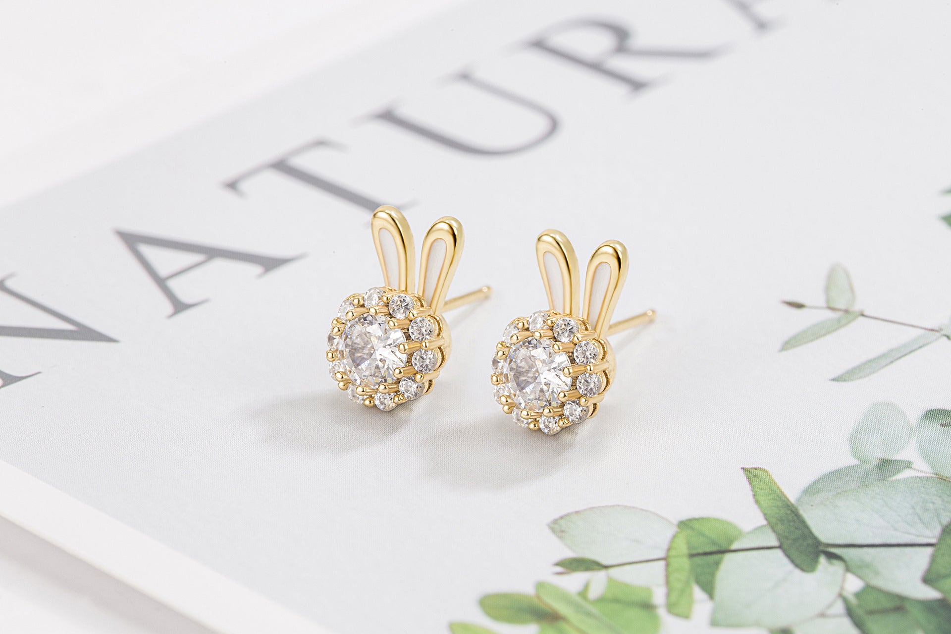 Pendientes de cobre de conejito giratorio al por mayor