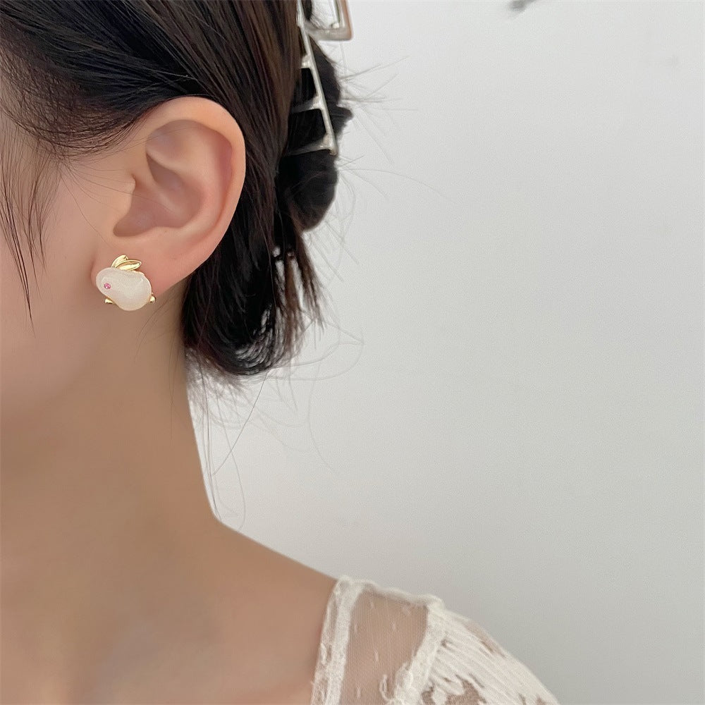 Wholesale Easter hollow asymmetrical white rabbit stainless steel earrings