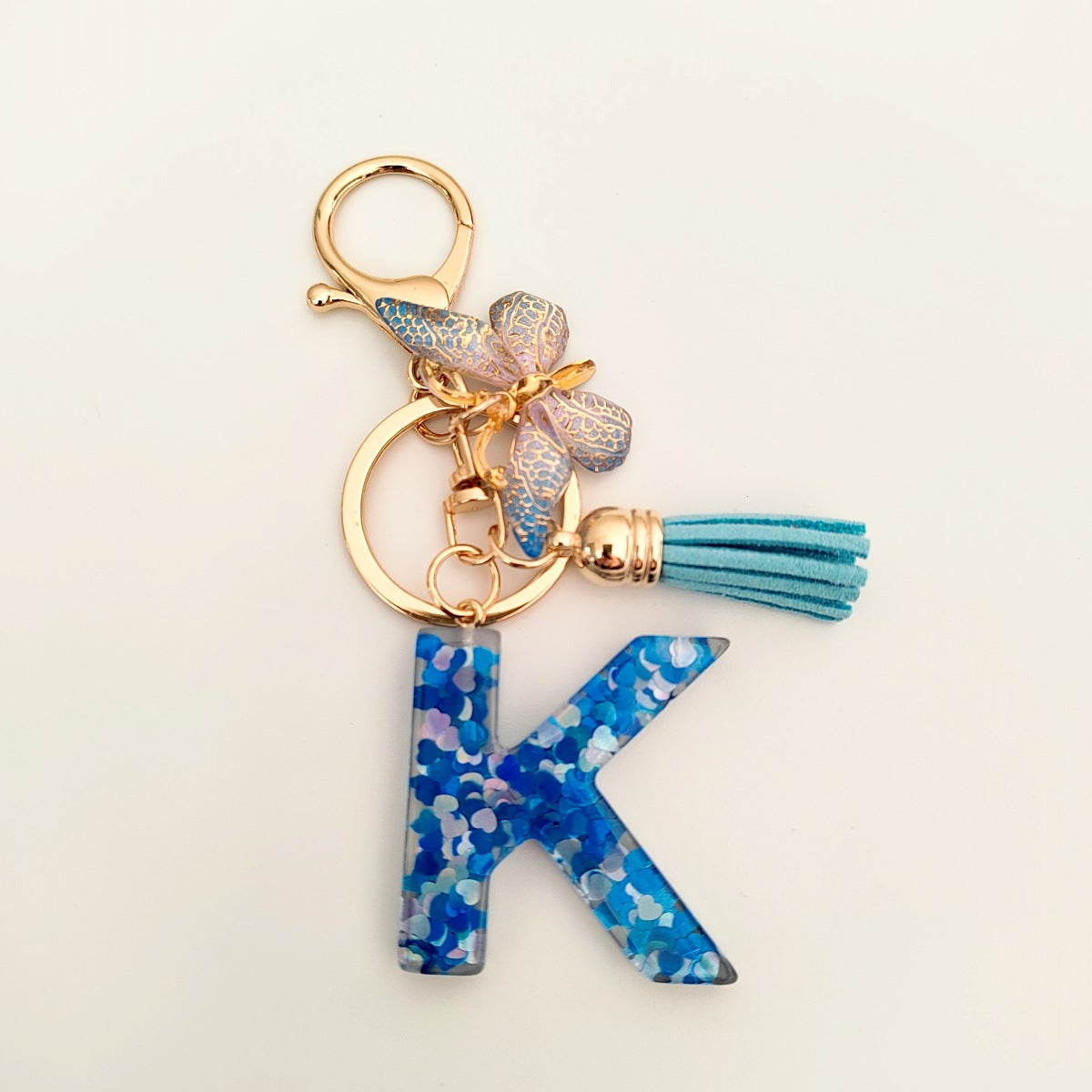 Wholesale blue crystal epoxy letter key chain pendant resin sequined butterfly key chain