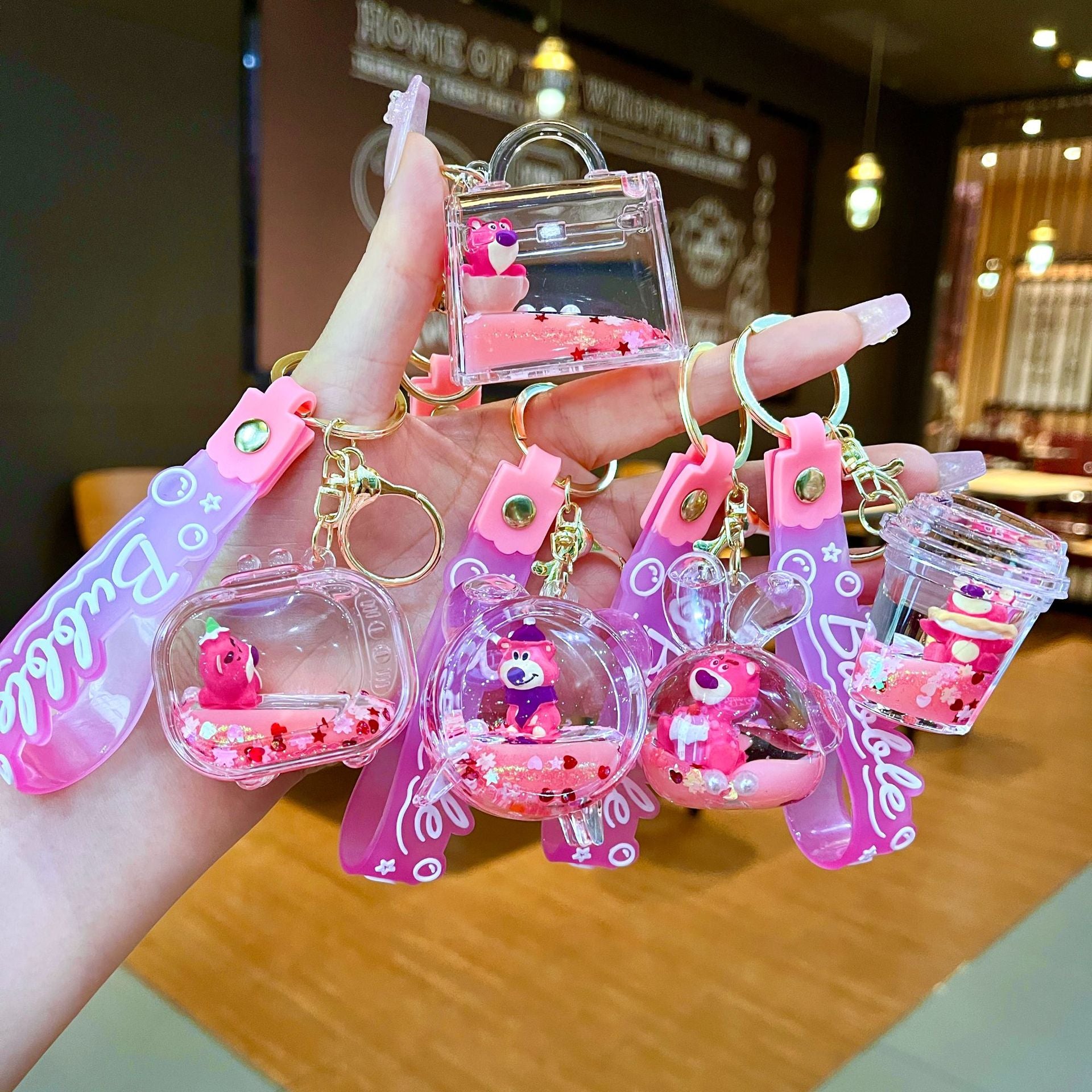 Wholesale Oil filled pink strawberry bear quicksand Keychains