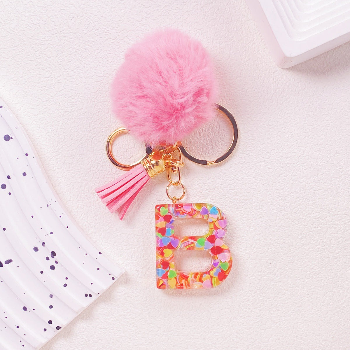 Wholesale Hairball English 26 letter pink Pom Pom keychain