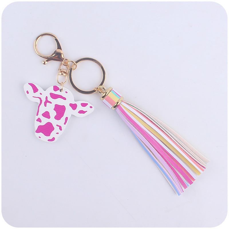 Caricatura al por mayor de toro occidental cabeza de madera colorida llavero largo de borla larga