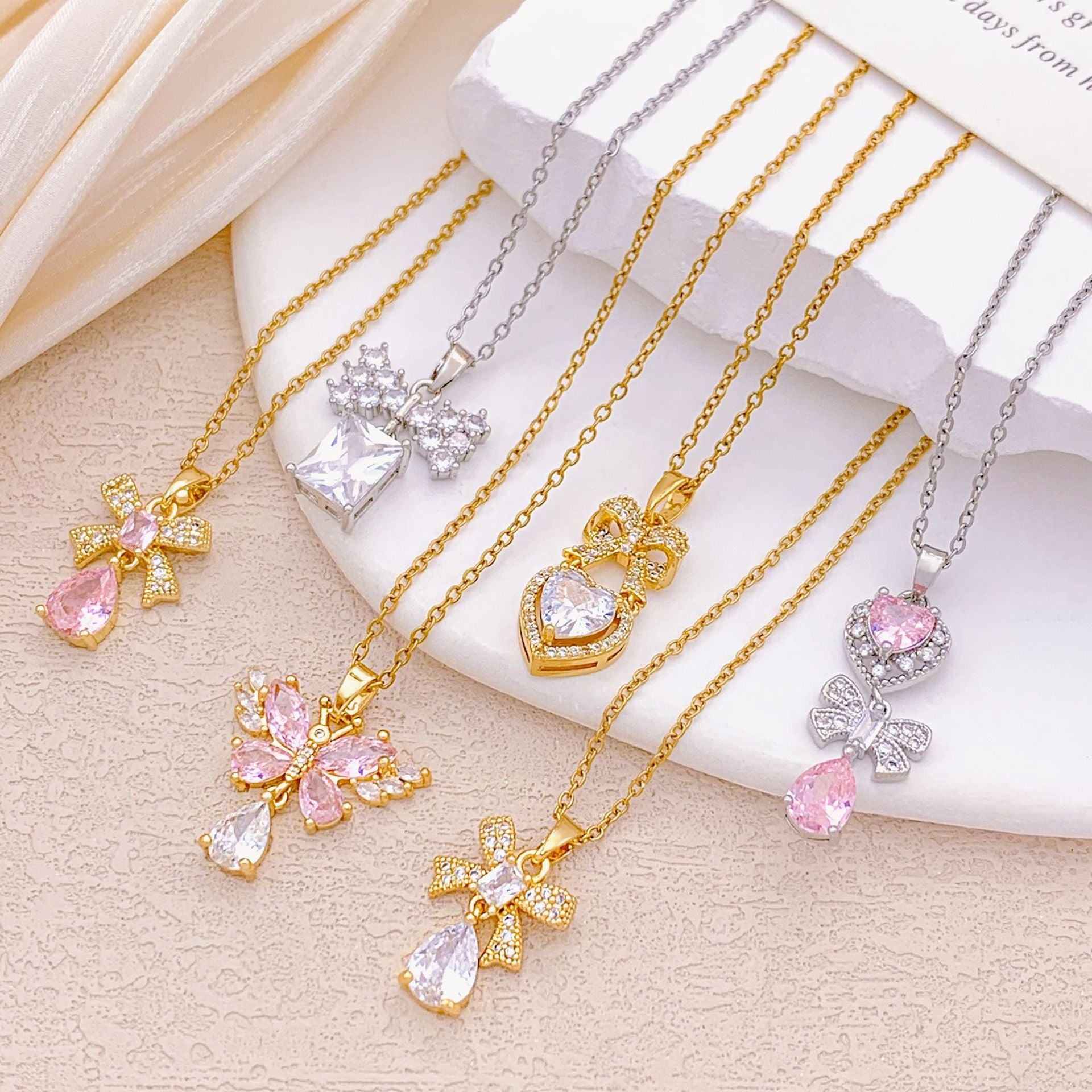 Wholesale Pink heart-shaped bow with diamond studded titanium steel necklace