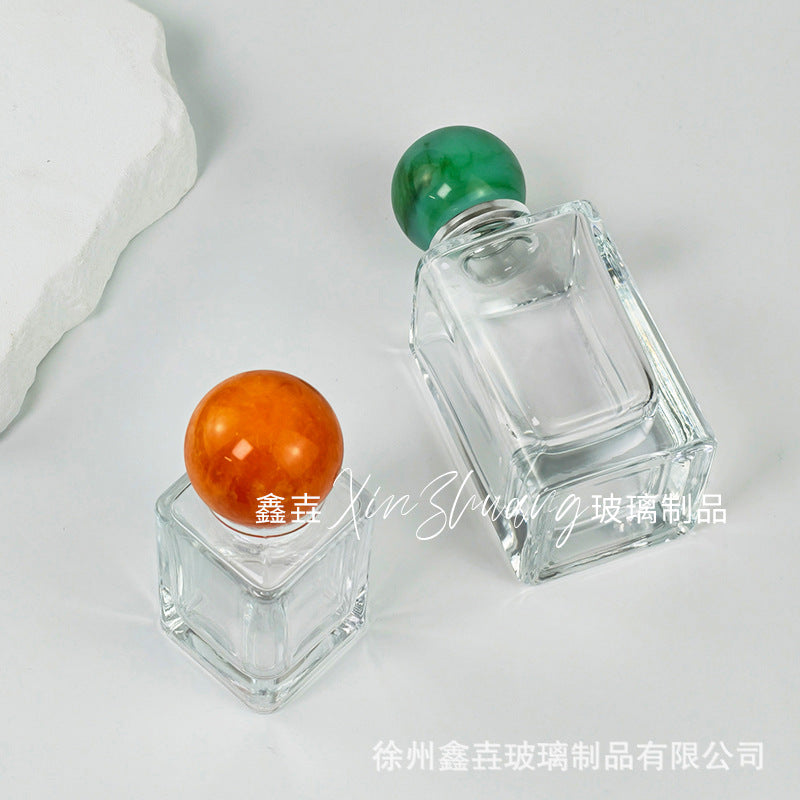 Wholesale 30ml/50ml/100ml transparent high-end perfume packaging glass bottle press spray nozzle perfume bottle