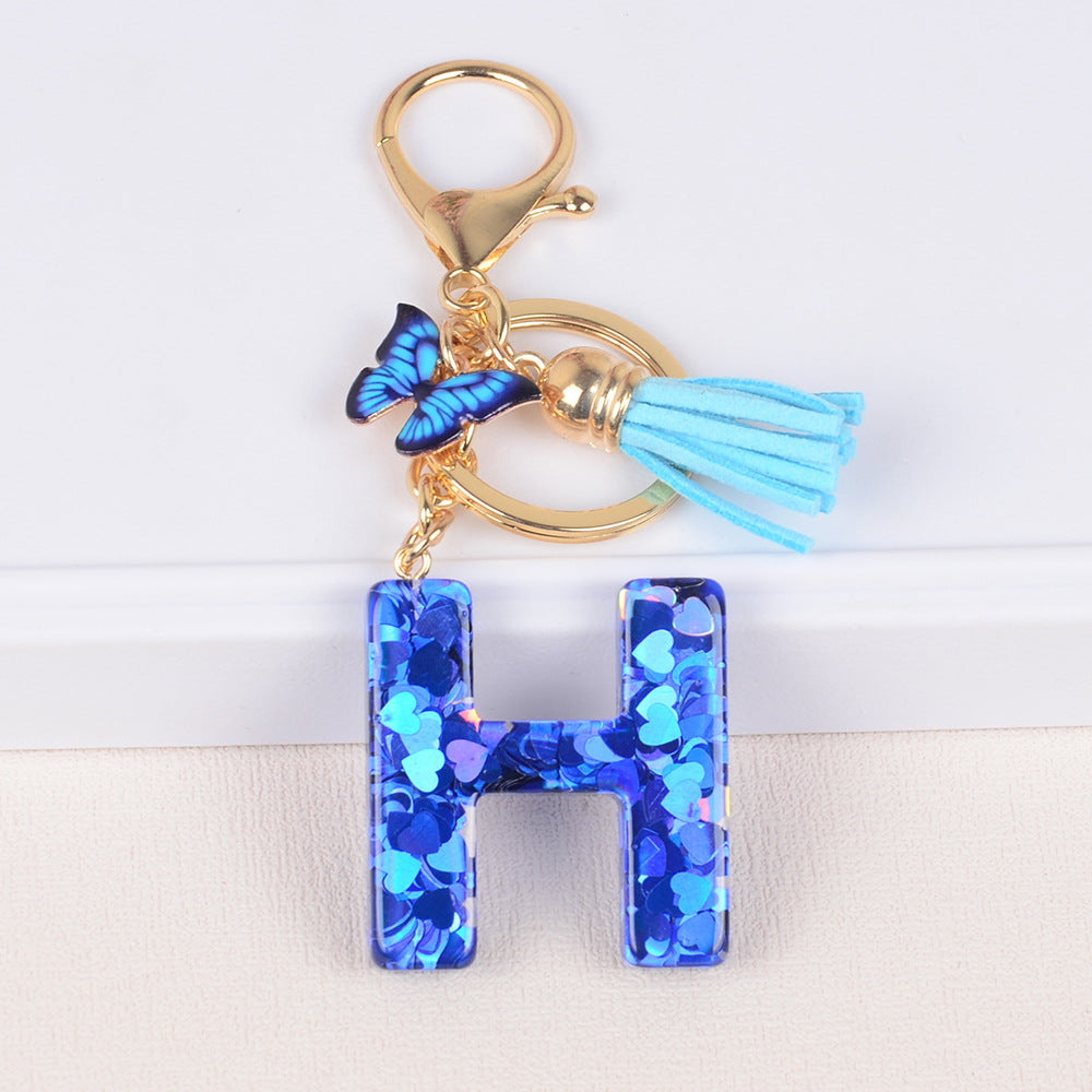 卸売ブルーラブバタフライタッセルレター樹脂キーホルダー