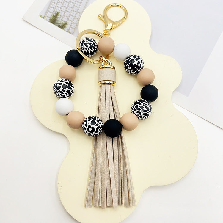 Wholesale Leopard Print White Bottom Wooden Beads Rubber Paint Round Beads PU Tassel Bracelet Keychain