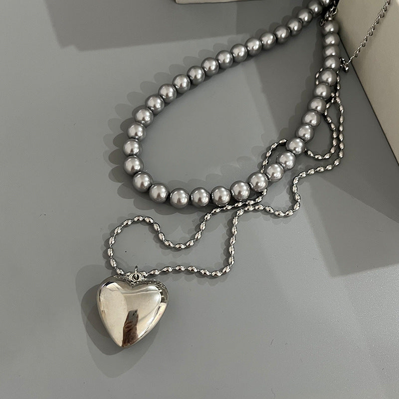 Wholesale Rice Bead Titanium Steel Necklace Hollow Heart Pendant Sweater Chain