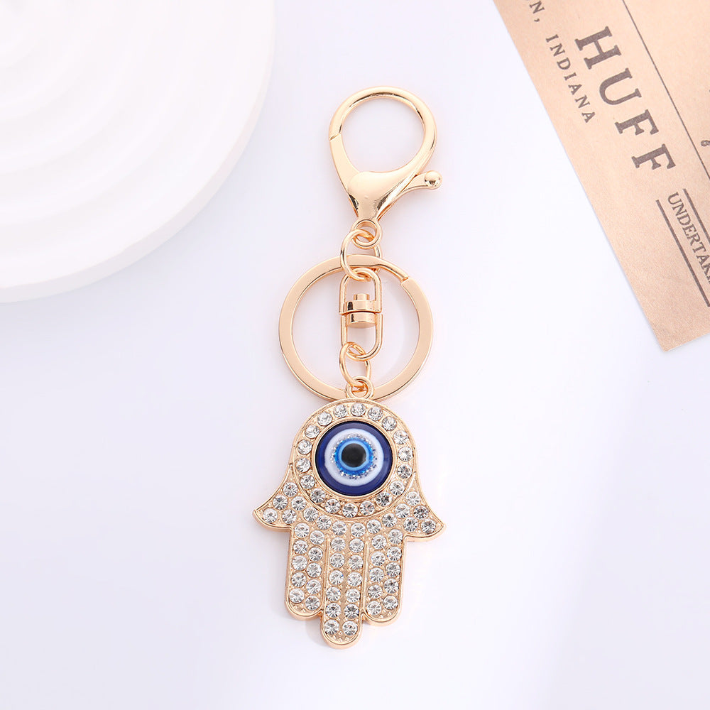 Wholesale Palm Devil' s Eye with Water Diamond Metal Keychain