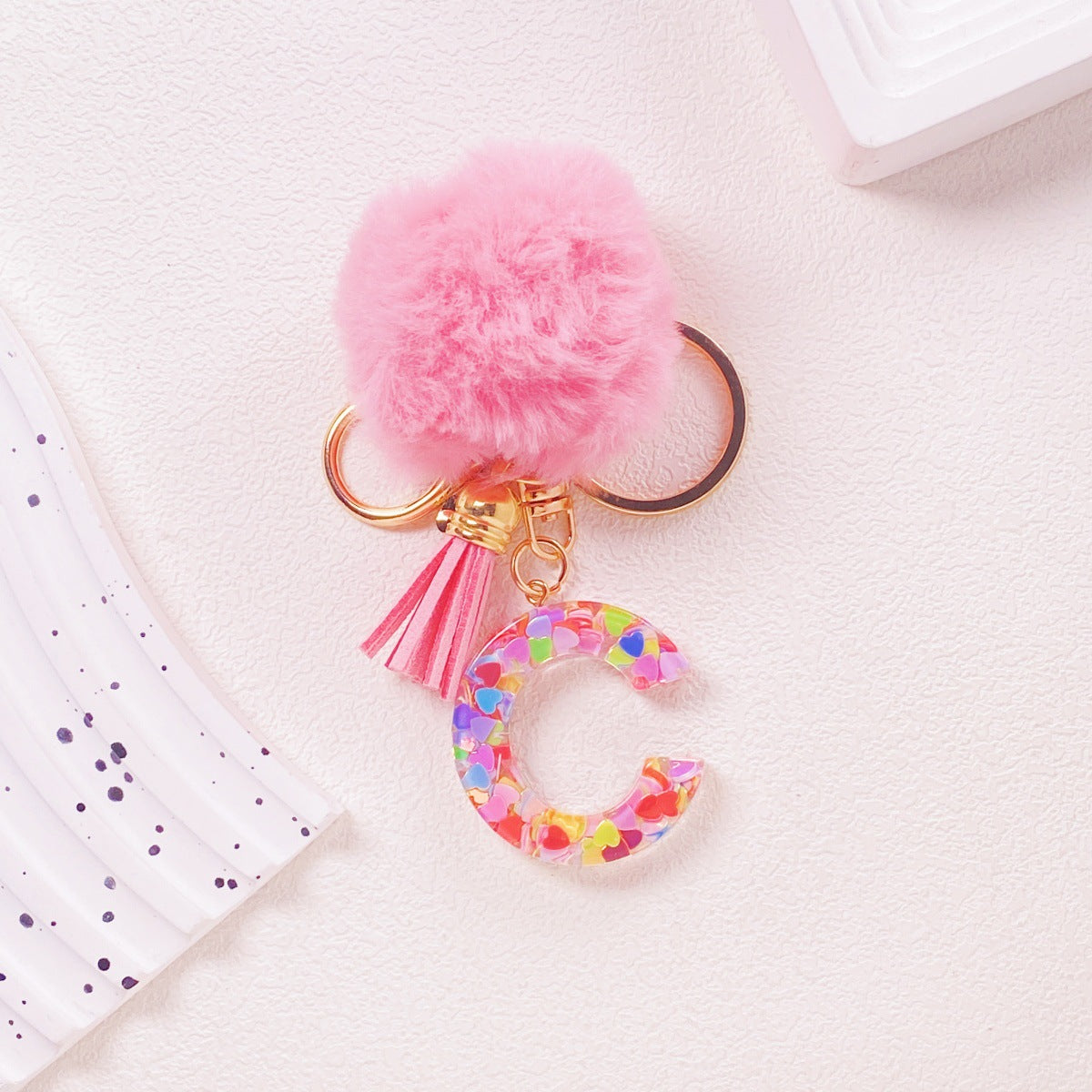 Wholesale Hairball English 26 letter pink Pom Pom keychain