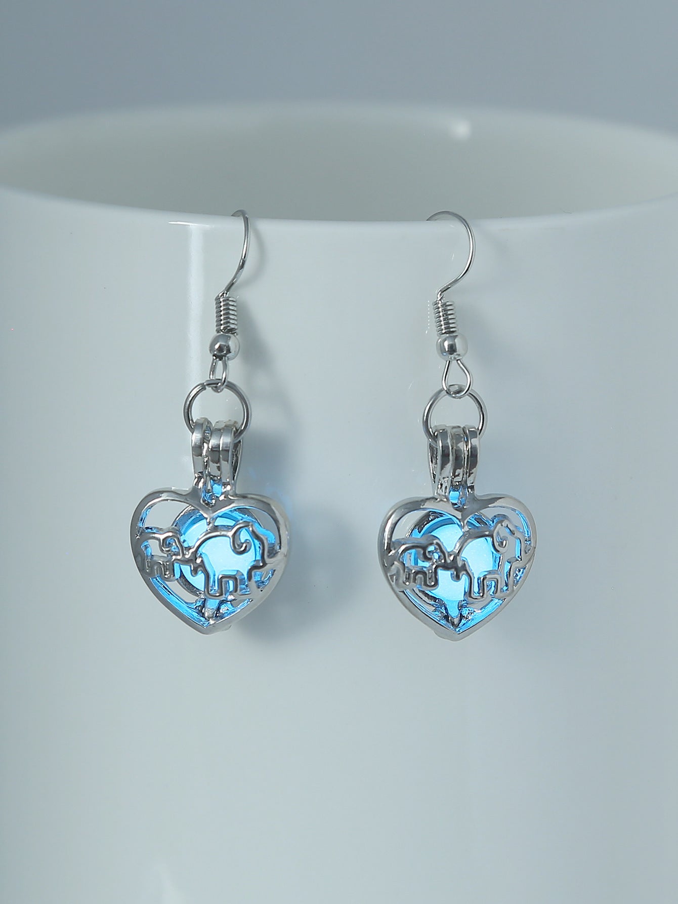 Wholesale Animal elephant baby elephant love hollow luminous earrings