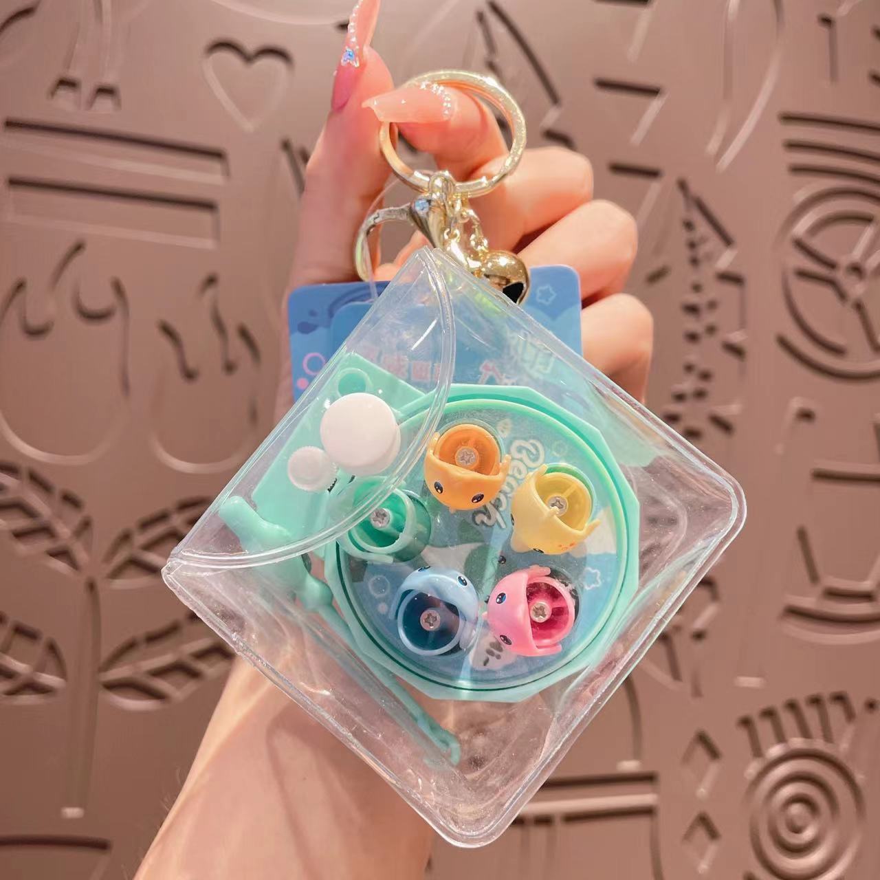 Llavero de la máquina de pesca giratoria acrílica al por mayor