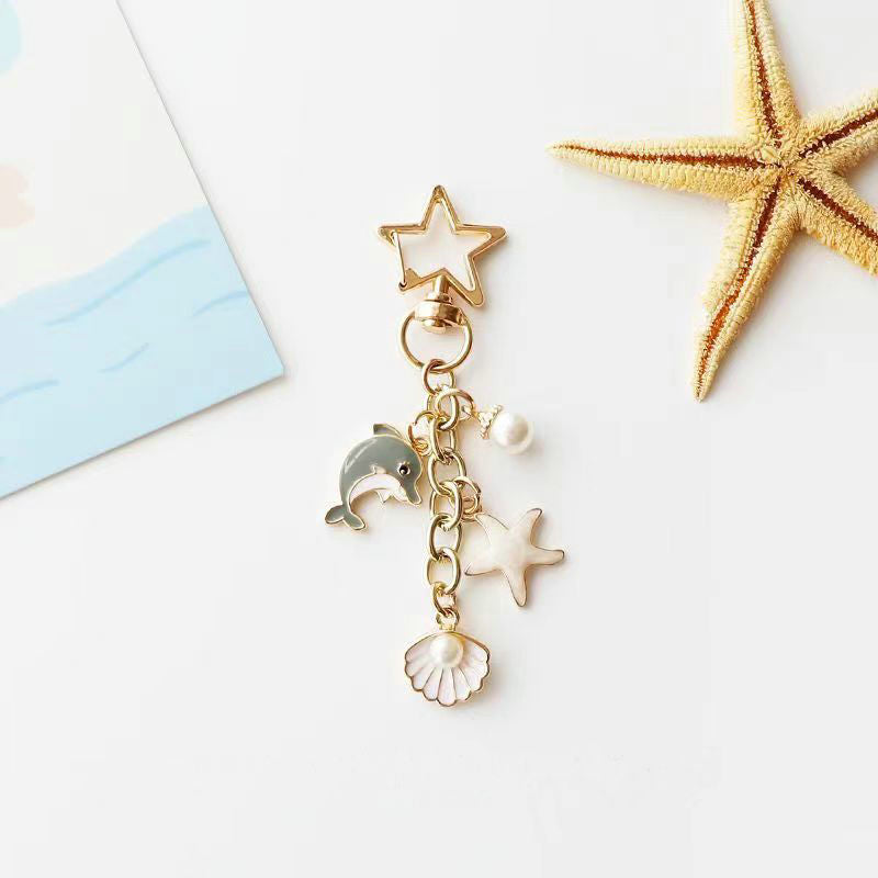 Lindo llavero de metal de estrellas de mar de delfines al por mayor