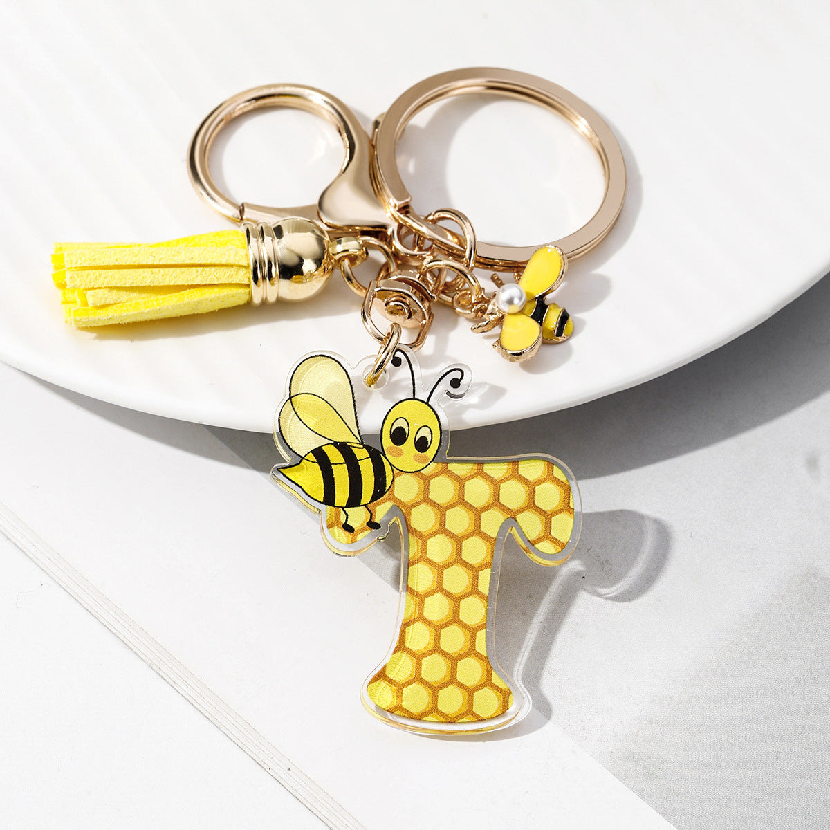 Wholesale Bee Honeycomb Acrylic English Letter Tassel Bee Enamel Keychain
