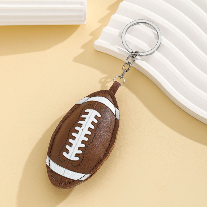 Wholesale Sport style PU padded cotton ball keychain pendant