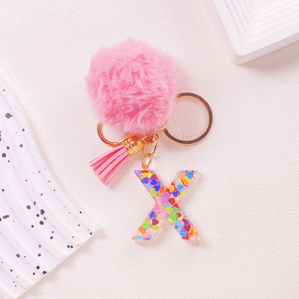 Wholesale Hairball English 26 letter pink Pom Pom keychain