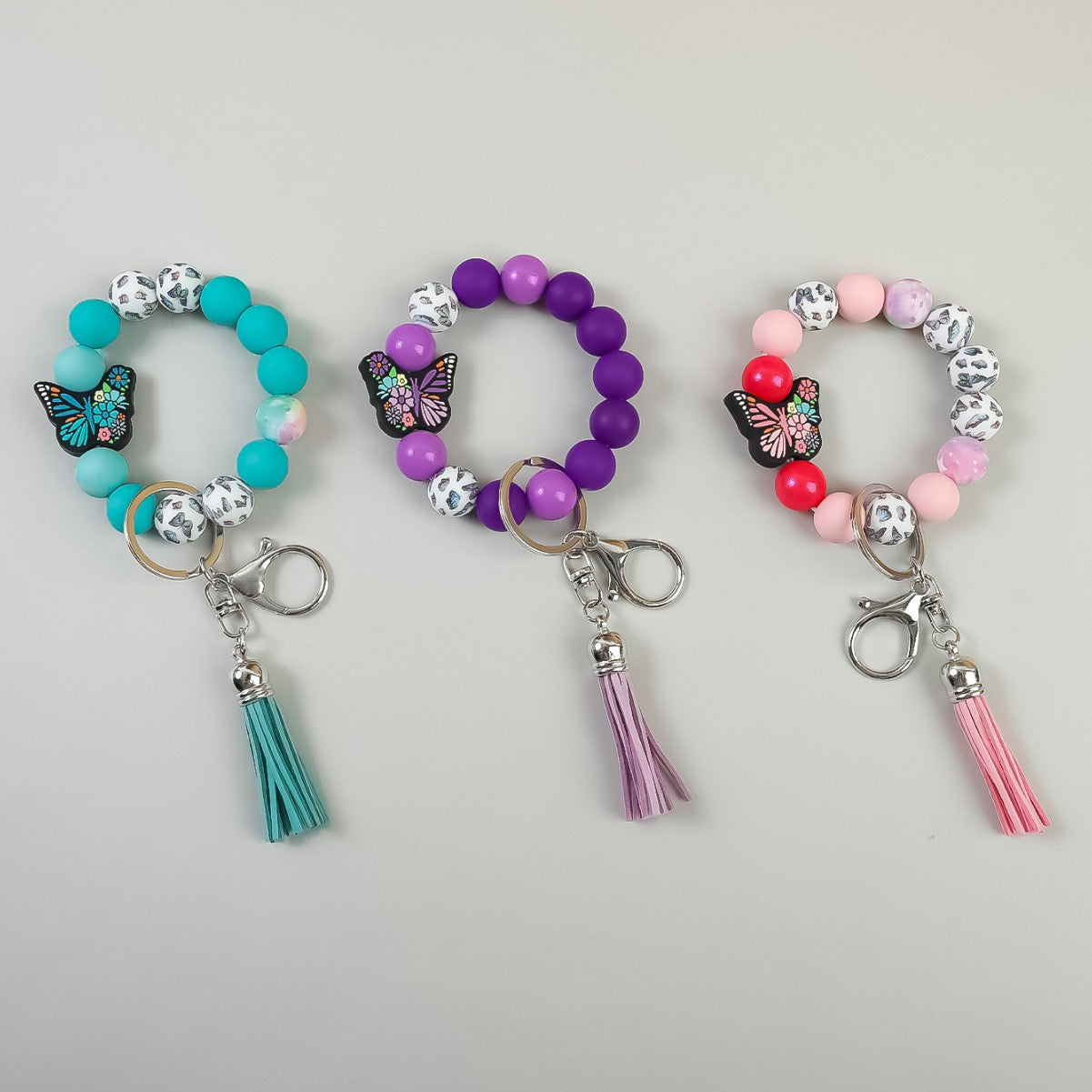 Wholesale Butterfly Pendant Beaded Wristlet Keychain Solid Color Silicone Wooden Keychain