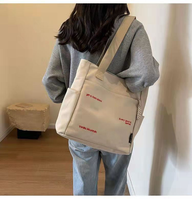 Wholesale Canvas bag shoulder bag large capacity commuter bag handbag bag