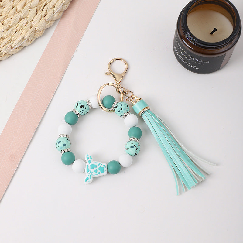 Llavero de muñeca de silicona de borla al por mayor