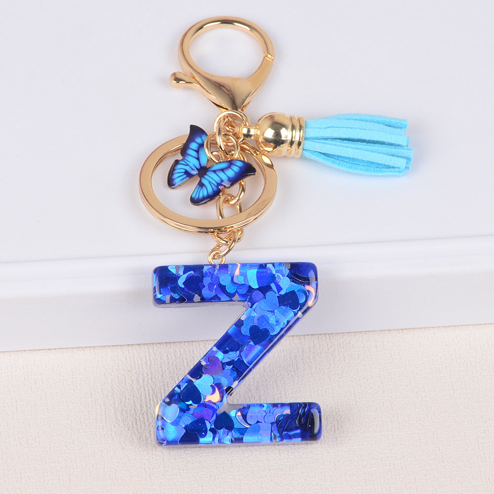 卸売ブルーラブバタフライタッセルレター樹脂キーホルダー