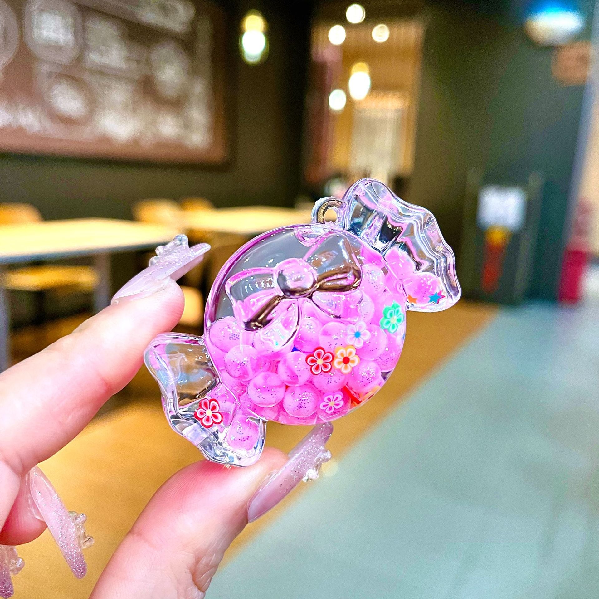 Wholesale Oil filled luminous colorful candy quicksand bottle keychain