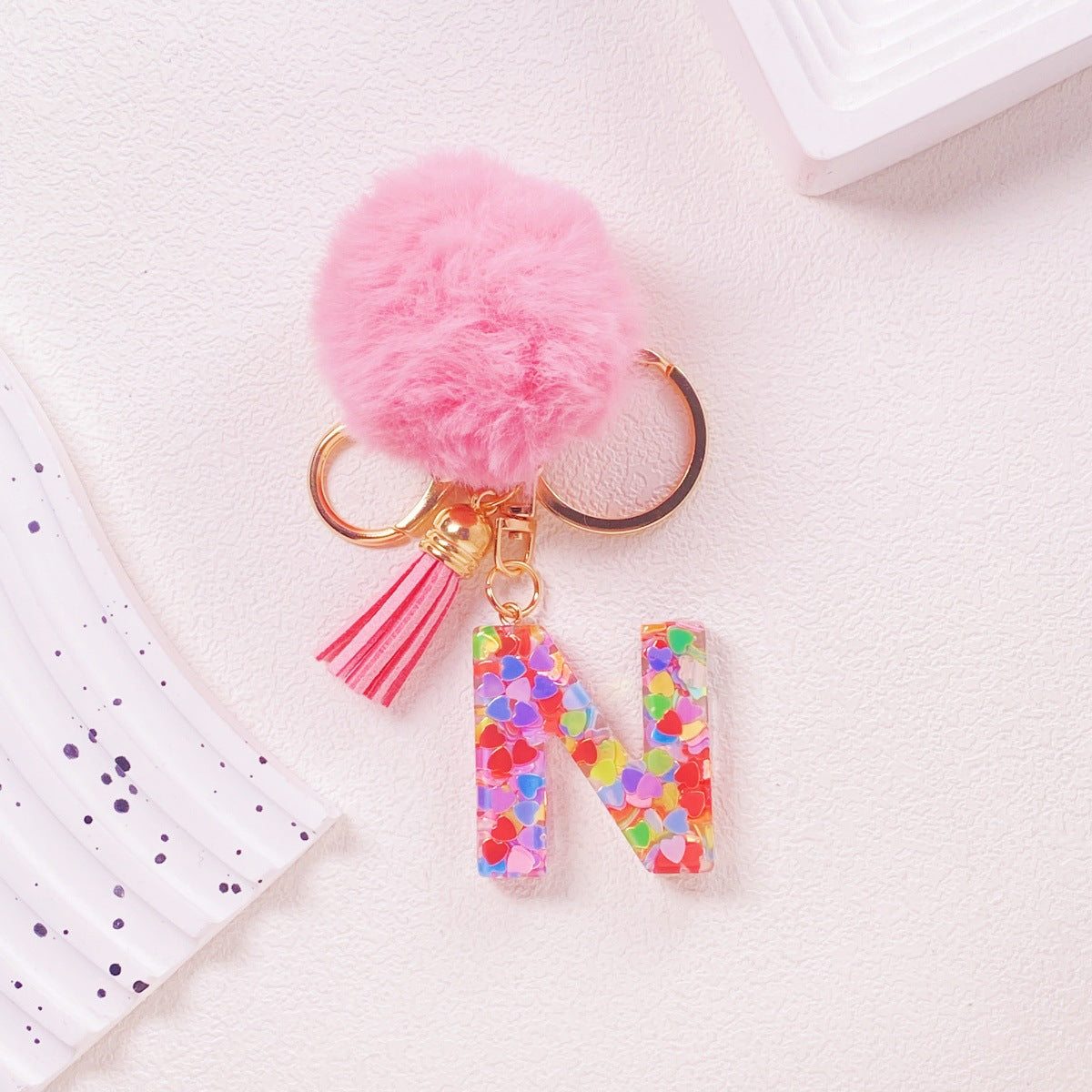 Wholesale Hairball English 26 letter pink Pom Pom keychain