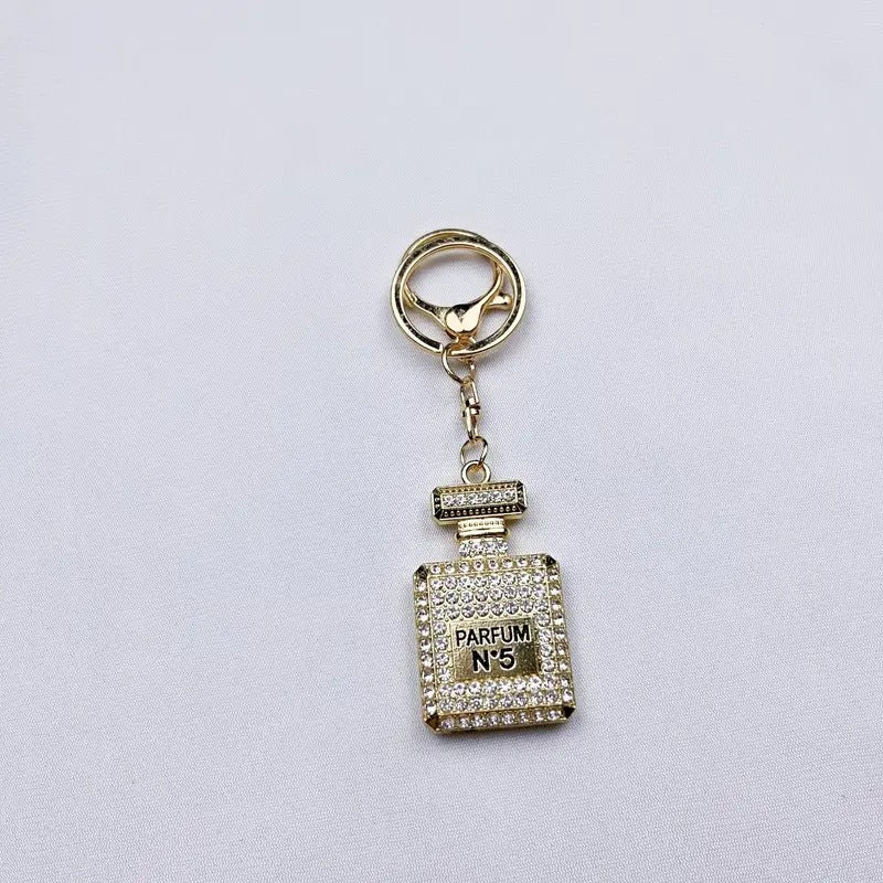Wholesale Diamond-studded perfume bottle creative metal keychain