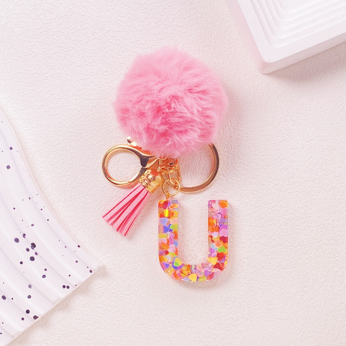 Wholesale Hairball English 26 letter pink Pom Pom keychain
