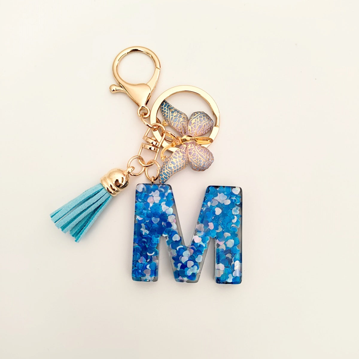 Wholesale blue crystal epoxy letter key chain pendant resin sequined butterfly key chain